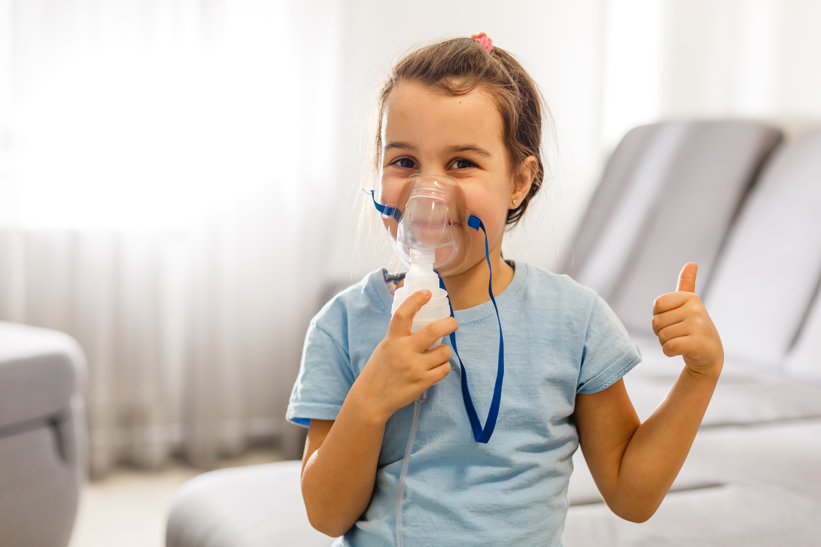 Little Girl Use Inhaler Nebulizer. Child Asthma Inhaler, Nebulizer Steam, Flu or Cold Concept. Copyspace