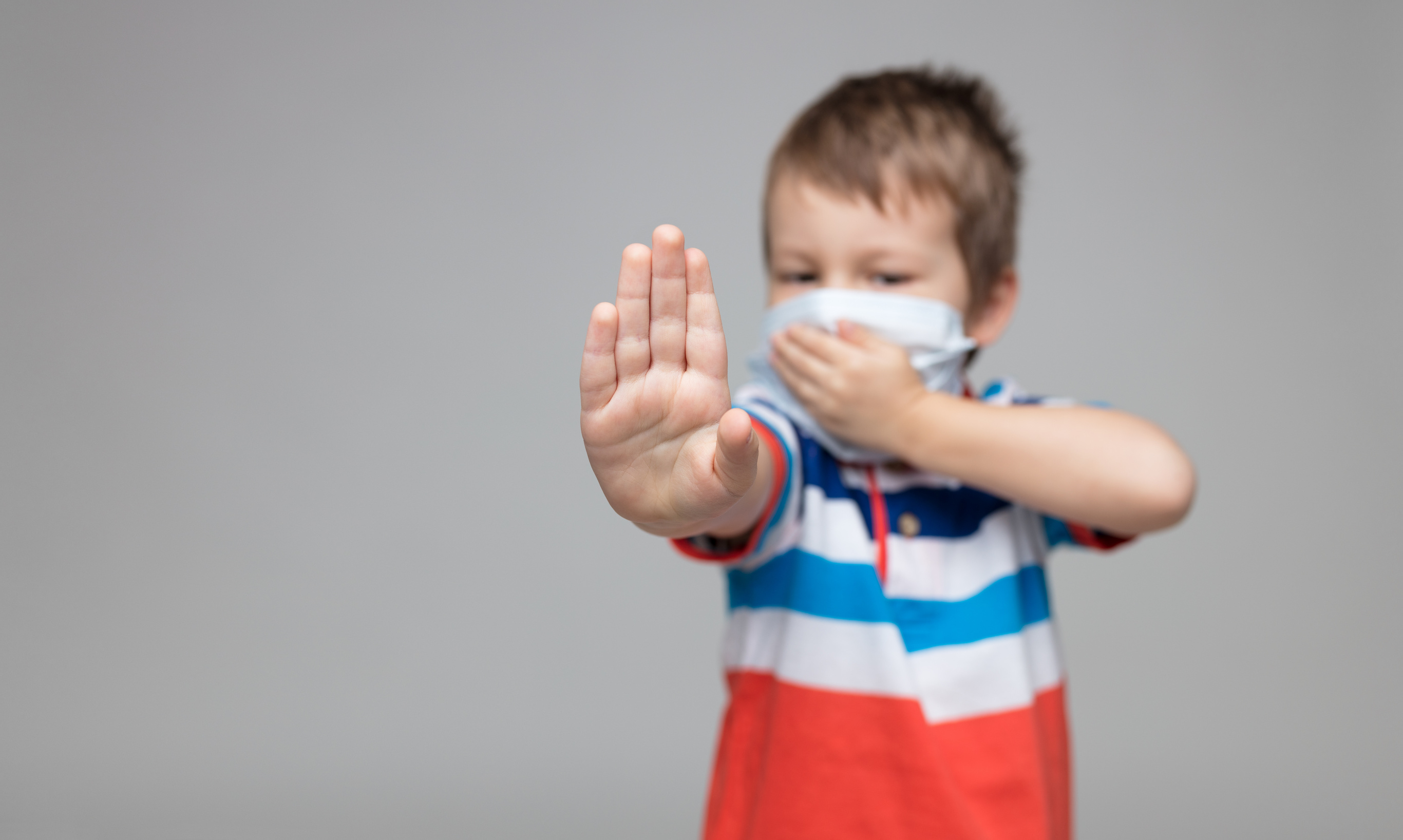 Young Child Wearing a Respiratory Mask